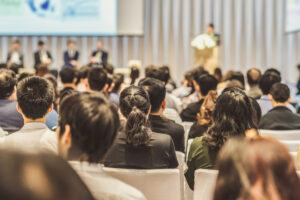 Rear view of Audience in the conference hall or seminar meeting
